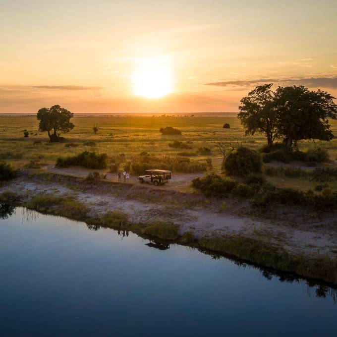 Aerial sundowner stop beside the Chobe River at sunset
