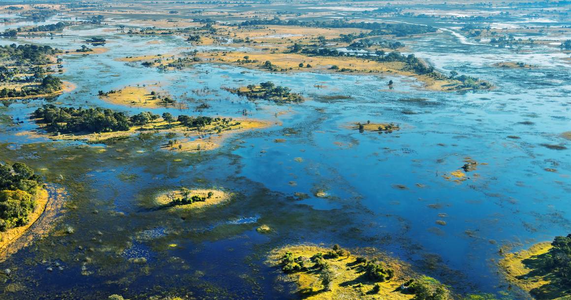 Aerial view of Okavango Delta floodplain and islands at golden hour