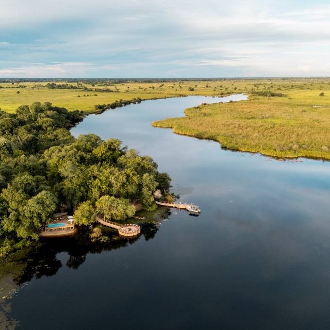 Aerial view of Xugana Island Lodge on the Okavango Delta lagoon