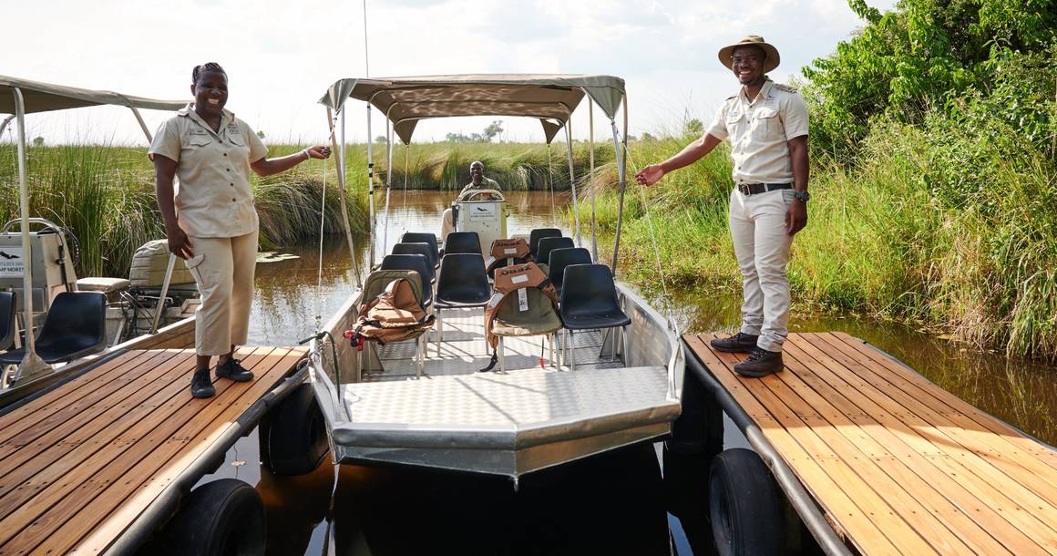 Camp Moremi guides welcoming guests at the Xakanaxa Lagoon motorboat