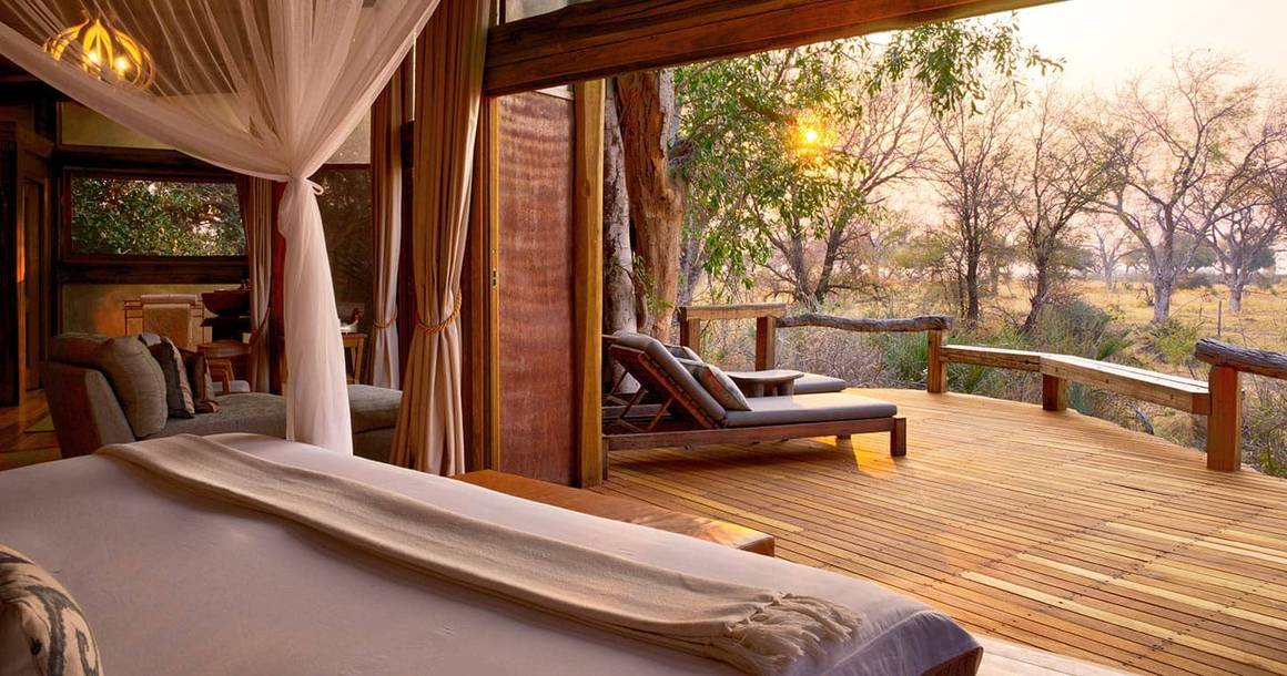 Camp Okavango tented suite opening to a private teak deck