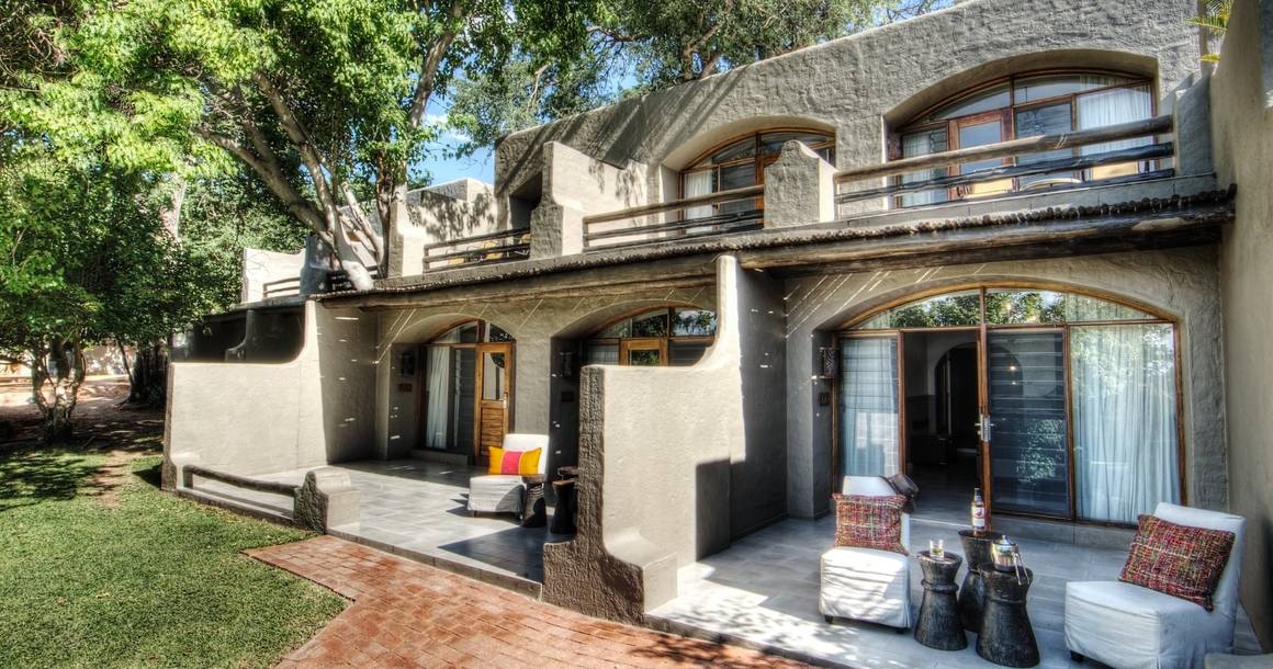 Chobe Game Lodge room exterior with garden terrace