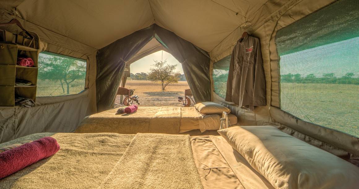 Letaka mobile tent interior with open flap overlooking the bush