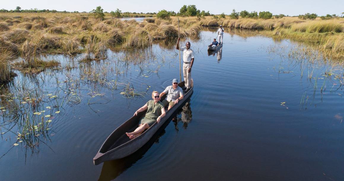 Mokoro excursion through calm Okavango Delta channels
