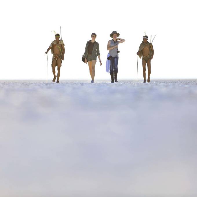 San Bushmen walk across the Makgadikgadi salt pan